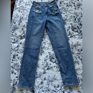 American eagle highwaisted blue jeans with a distressing below pockets